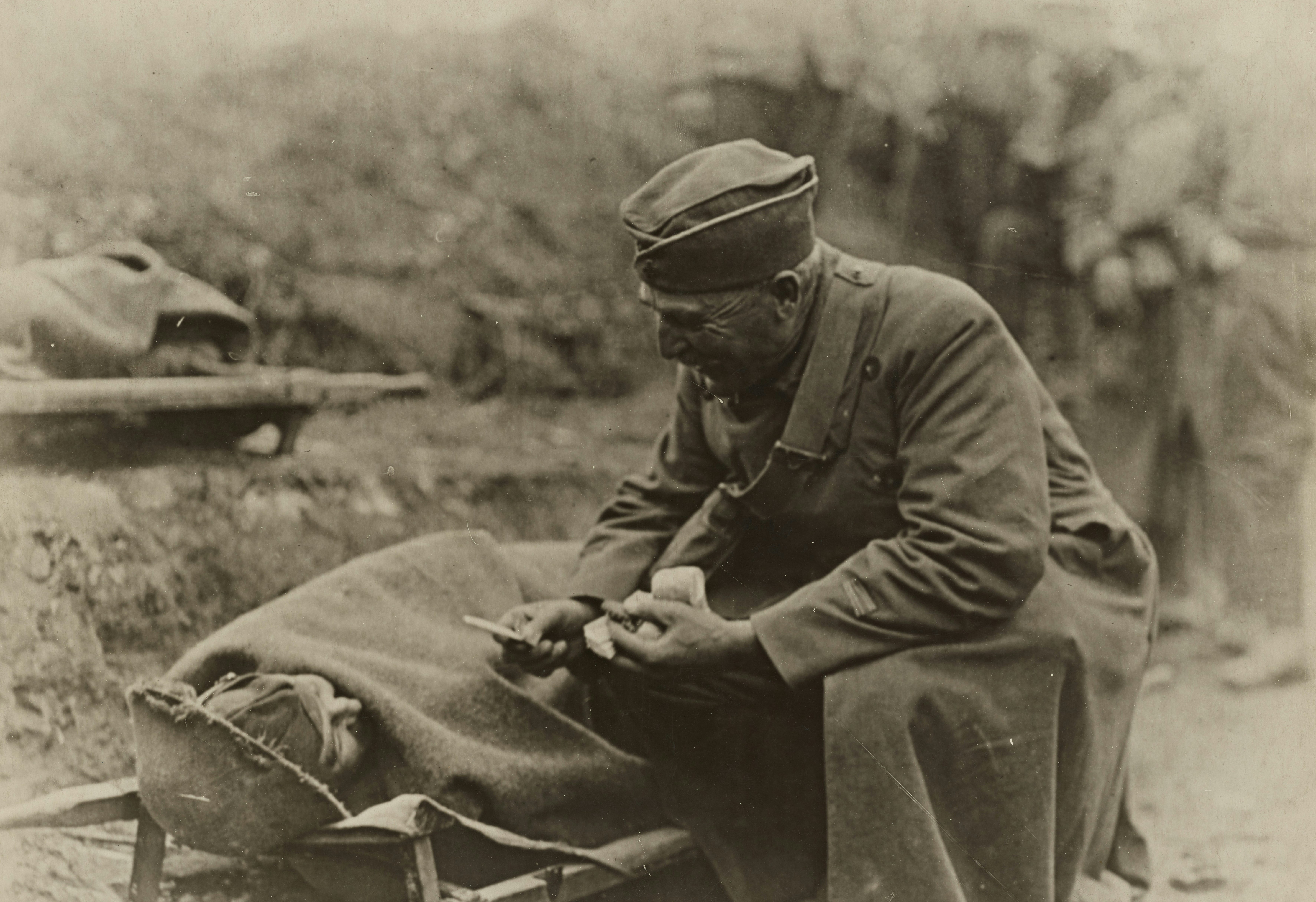 soldier offering a fellow soldier a cigarette